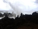 Crashing waves on volcanic rock
