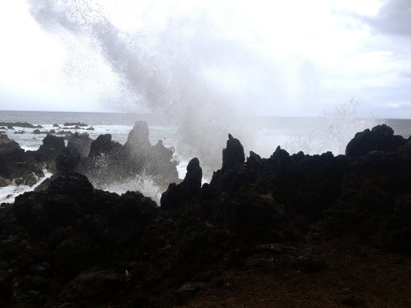 Crashing waves on volcanic rock
